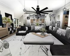 a living room filled with black and white furniture