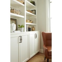 a chair and some shelves in a room