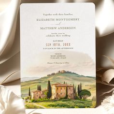 a wedding card with an image of a tuscann house and trees in the background