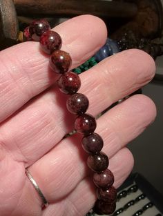 ** Our bracelets are handmade using quality materials & real gemstones.  This Red Garnet 8mm Bead Stretch Bracelet is perfect for metaphysical and spiritual use. Measuring approximately 3 inches in diameter, this bracelet stretches to fit comfortably on your wrist. Each bracelet is unique due to the natural variation of the individual pieces, making it a one-of-a-kind addition to your collection. However, please note that this bracelet is on the smaller side and should not be stretched beyond it Spiritual Red Jewelry With Faceted Beads, Red Agate Beaded Bracelet For Meditation, Red Hand-strung Casual Stretch Bracelet, Red Garnet Crystal Bracelet, Red Bohemian Hand-strung Stretch Bracelet, The Simple Life, Garnet Bracelet, Beaded Stretch Bracelet, Red Garnet