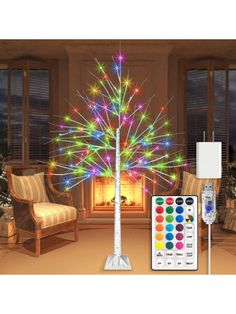 a christmas tree with multicolored lights and remote control