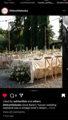 the wedding table is set up with white flowers and greenery on it for guests to enjoy