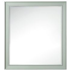 a white framed mirror with beading around the edges and an edge on the bottom