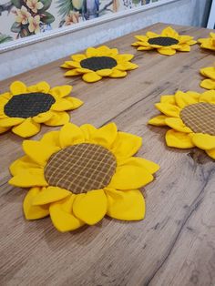 sunflowers made out of cardboard sitting on a table