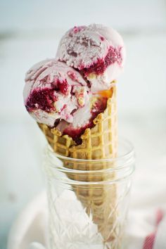 two scoops of ice cream in a glass jar