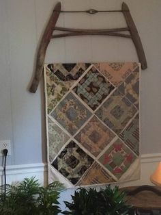 a wall hanging made out of old quilts