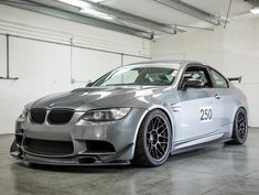 a silver car is parked in a garage