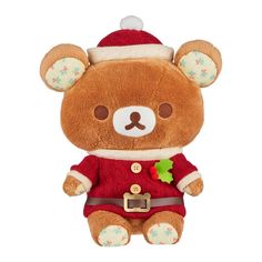 a brown teddy bear wearing a red sweater and santa hat with green leaves on it's chest