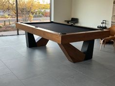 a pool table in the middle of a room