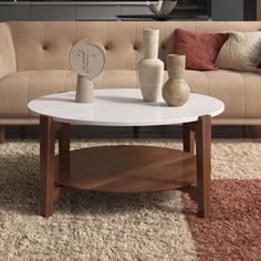 a living room with a couch, coffee table and vases on the carpeted floor