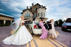 the bride and groom are getting into their car