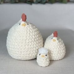 two crocheted chickens sitting next to each other