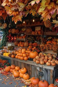 an outdoor market filled with lots of pumpkins