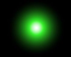 a green light shining in the dark with only one light on it's side