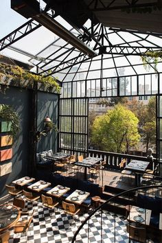 an outdoor dining area with tables and chairs