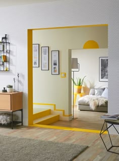 a living room with yellow accents and white walls