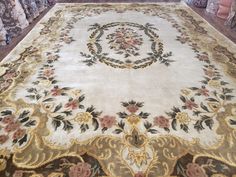 a large area rug is on display in a store