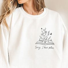 To all my fellow book lovers out there who would rather be reading right now, this one's for you. This is the perfect gift for bookworms who enjoy spending the whole day with their noses in books and the bookish ones who's weekends are always fully booked!  *This sweatshirt is printed in the United States* *Made from 50% Cotton and 50% Polyester* Our sweatshirts are unisex. Please refer to the size chart in the picture for sizing.  For sweatshirt care, we recommend that you machine wash: warm; n Book Shirt Design, Booktok Sweatshirts, Bookish Shirt Ideas, Bookish Sweaters, Library Sweatshirt, Book Sweatshirts, Bookish Sweatshirts, Bookworm Tshirts, Bookish Designs