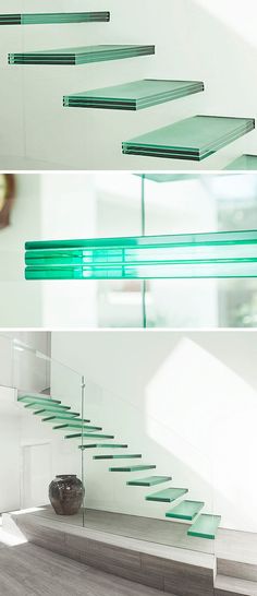 the stairs are made of glass and have green railings on each side, along with a vase