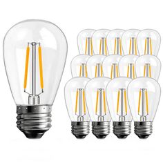 a bunch of light bulbs sitting next to each other on a white surface with yellow trim