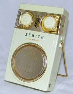 an old fashioned radio sitting on top of a white table