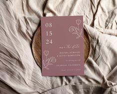 a wedding card on top of a bed