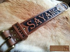 a brown leather belt with the words san francisco on it