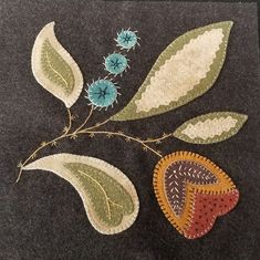 a piece of cloth with leaves and flowers on it