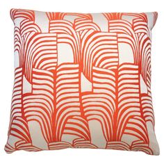 an orange and white pillow with wavy lines