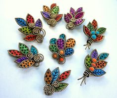 a group of multicolored butterflies sitting on top of a white table