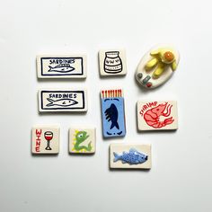 several magnets with different types of food on them