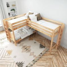 a wooden bunk bed sitting next to a white rug on top of a hard wood floor