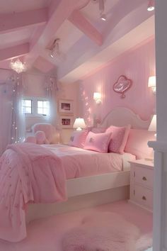 a bedroom decorated in pink and white with lots of lights on the ceiling above the bed