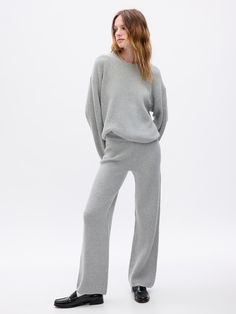 Supersoft cotton-blend, shaker-stitch sweater pants.  Elasticized waist.  Fit: Slim.  A semi-fitted silhouette that fits close to the body at the waist and hip, with a slight ease through the thigh.  Models wearing Gap What To Pack For Paris, Knit Loungewear Set, Sweater Sets, Heavy Clothing, Knit Loungewear, October Fashion, Neutral Sweaters, Cozy Pants, Stitch Sweater