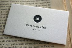 a piece of paper with the words evanakks on it sitting on top of an open book