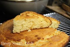 two pieces of bread sitting on top of a metal rack next to a skillet