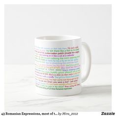 a coffee mug with the words roman expressions on it in multicolored texting