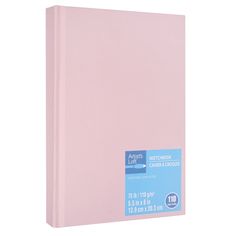 a pink hardcover notebook with blue writing on the cover