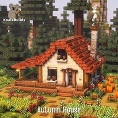 an image of a small house in the middle of some trees and bushes with pumpkins around it