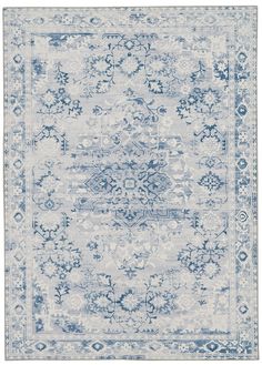 a blue and white rug with an ornate design