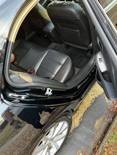 the interior of a car with its door open