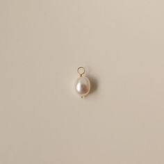 A single charm with freshwater baroque pearl. It's removable and interchangeable with any of the earrings from our Build Your Own Earring collection:  https://www.etsy.com/ca/shop/PrettyPearlfect/?section_id=37577451   It can be added to a necklace as well!   Details Approx. 9-10mm freshwater baroque pearls. The price is for ONE piece. 14K gold filled/sterling silver. Warranty We do understand that handmade jewelry can be delicate, that's why we are offering a 30-day warranty for your purchase. Freshwater Pearl Jewelry, Baroque Pearl Earrings, Earring Collection, Earring Charms, Pearl Earring, White Jewelry, Pearl Charms, Earrings Collection, Custom Necklace