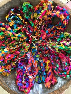 Beautiful, colorful, Farmhouse-Boho Garlands! Sassy, sweet and unique! They are made to be Boho-chic and have threads that are frayed for the purpose of flair and individuality, fun and totally adorable! These one-of-a-kind beauties are each 6 feet long and vary in width from 1/2-1 inch and made from frayed and frilled 100% vibrant sari silk.  Both sides have a thin jute string tied on for attaching to branches etc. These eye-catching, stunning colors will decorate your home with happiness. Knock your holidays into high gear by adorning your holiday tree or mantle. But don't stop at the holidays! Use year round by wrapping them around any corner turning it into something special. Too cute to put away!  Each one will be unique. The absolute perfect gift for yourself and a friend!  Colors wi Boho Garland, Colorful Farmhouse, Farmhouse Boho, Christmas Decorations Diy Outdoor, Sari Silk, Holiday Tree, Fabric Art, Diy Outdoor, Hanging Signs