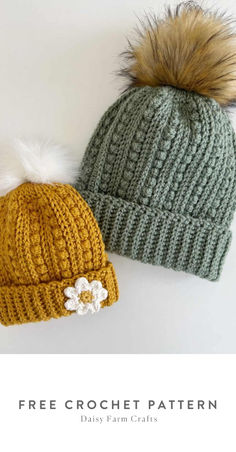 two knitted hats with pom poms on them, one is green and the other is yellow