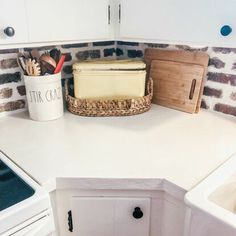 the kitchen counter is clean and ready to be used as a storage area for utensils