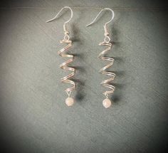 Everything is 25% off as a thank you for supporting my new Etsy shop. These double spiral earrings feel simply elegant when you were them.  They look great with everything. Made with: ~silver plated wire ~6 mm light pink bead ~925 sterling silver earrings hooks  Also comes with clear silicone earring backs Handmade jewelry is great because each piece is truly unique, so minor variations from one piece to another is completely normal. Spiral Earrings, Pink Beads, Wire Earrings, 925 Sterling Silver Earrings, Elegant Earrings, Earring Backs, Light Pink, Beaded Earrings, Diy Jewelry