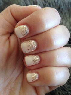 nude acrylic nails with emerald green rhinestones Glitter At Bottom Of Nails, White Nails With Gold Glitter Ombre, Ivory Gold Nails, Gel Nail Paint For Short Nails, White With Gold Glitter Nails, White Gel Nails With Glitter, White Nails Gold Glitter, White And Gold Glitter Nails, White And Gold Nails Simple