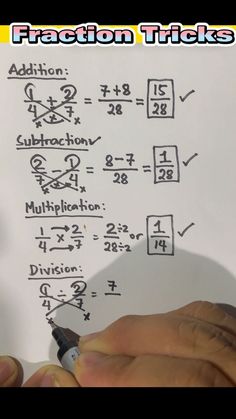 someone is writing numbers on a piece of paper with the addition and subtraction symbols