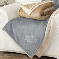 a personalized throw blanket on a couch