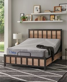 a bed in a room with gray walls